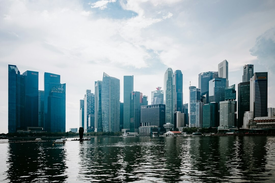 Business meeting inside a Singapore office with skyline view